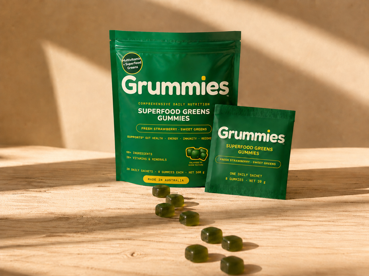 Grummies pouch and sachet with a loose spill running off the edge of a sunlit bench